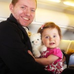 Travis and Emma This is them in the airplane after just arriving in LA, Emma loves that little white kitty.