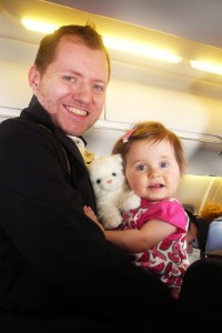 Travis and Emma This is them in the airplane after just arriving in LA, Emma loves that little white kitty.